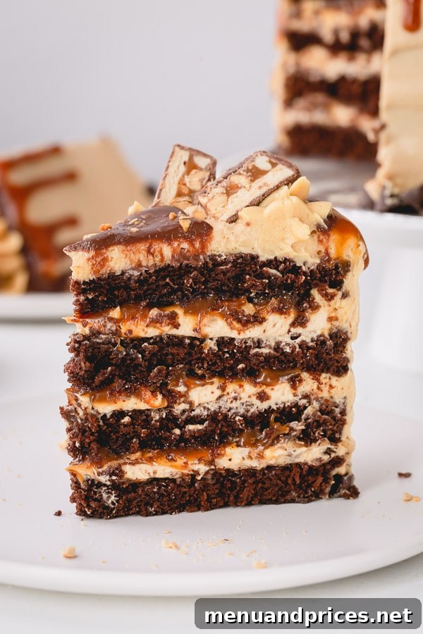 Indulgent Snickers Cake of your dreams!!! So many incredible layers! #snickerscake #layercake #chocolatecake