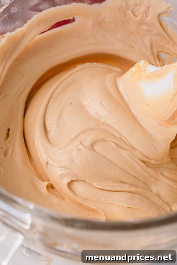 Seriously, nothing beats light and fluffy salted caramel buttercream frosting!! Incredibly easy to make with just 3 ingredients, it’s going to be your favorite buttercream frosting of all times. #caramelbuttercream #saltedcaramelbuttercream #buttercreamfrosting