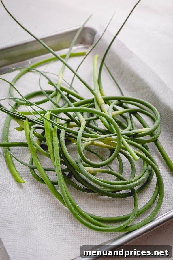 3 BEST things to do with garlic scapes. Learn how to prepare scapes, how to store and deliciously simple ways to use those versatile long greens!
