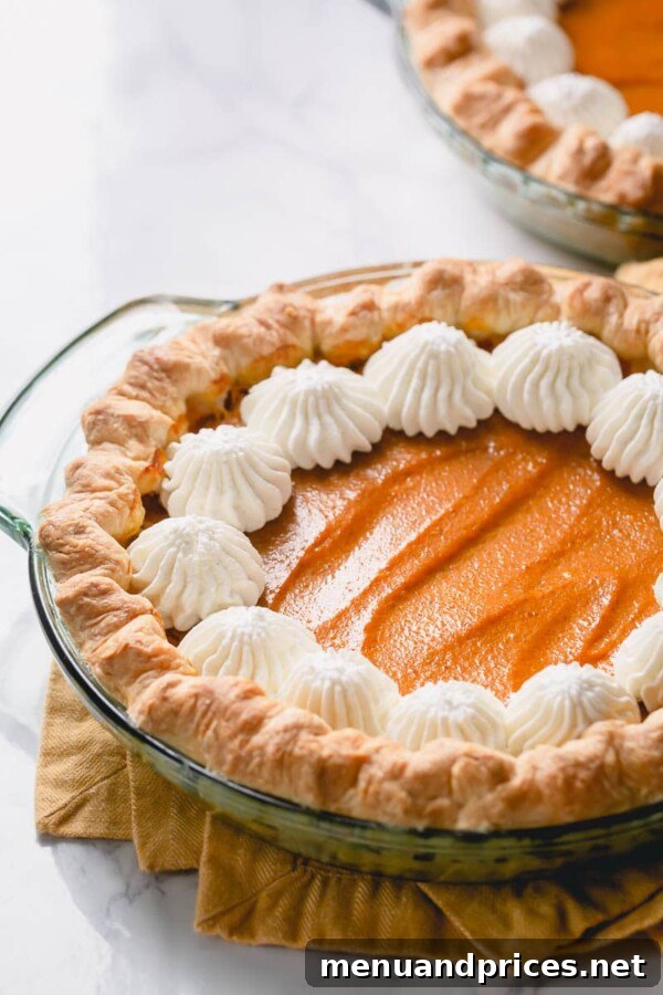 No-Fuss Pumpkin Pie Perfection 3 A close-up shot of a perfect slice of pumpkin pie, showcasing its smooth, creamy filling and the crisp, golden crust.