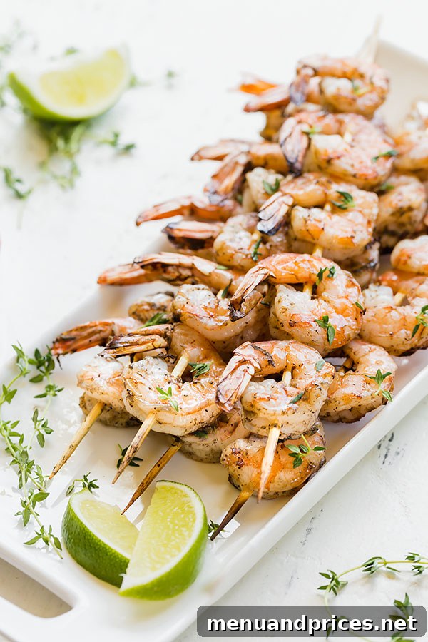 Tropical Jerk Shrimp Skewers 2 Slightly spicy, slightly smoky and absolutely delicious Jamaican Jerk shrimp skewers are the perfect new favorite summer meal! Quick and easy, these succulent shrimp are delicious with plain white rice or mango salsa. #easydinner #appetizer #shrimpskewers #jamaicanjerkshrimp #grilledshrimp