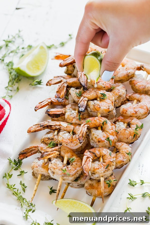 Tropical Jerk Shrimp Skewers 6 Absolutely delicious Jamaican Jerk shrimp skewers, a slightly spicy and smoky summer favorite! Quick and easy to make, these succulent shrimp are amazing with plain white rice. #easydinner #appetizer #shrimpskewers #jamaicanjerkshrimp #grilledshrimp