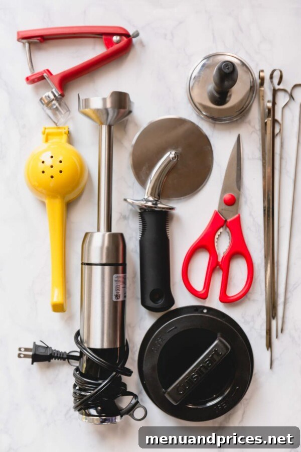 12 Kitchen Gadgets You Didn't Know You Needed 2 Selection of time-tested kitchen tools and gadgets displayed on a kitchen counter, ready to enhance the cooking experience.