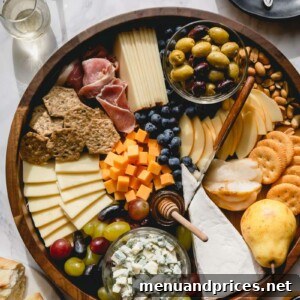 A vibrant charcuterie and cheese board with various ingredients.