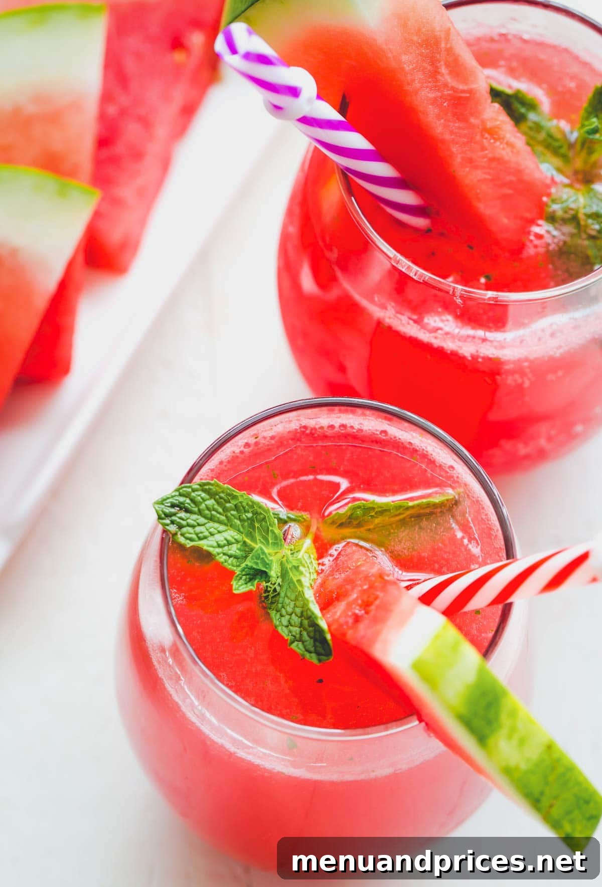Watermelon Mint Chill 7 Multiple glasses of Minty Watermelon Fizz with fresh mint and watermelon garnishes, ready to be served.