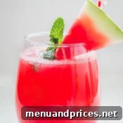 Close-up of a glass of Minty Watermelon Fizz with a refreshing look.