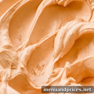 Salted Caramel Swiss Meringue Buttercream in a bowl with a spoon