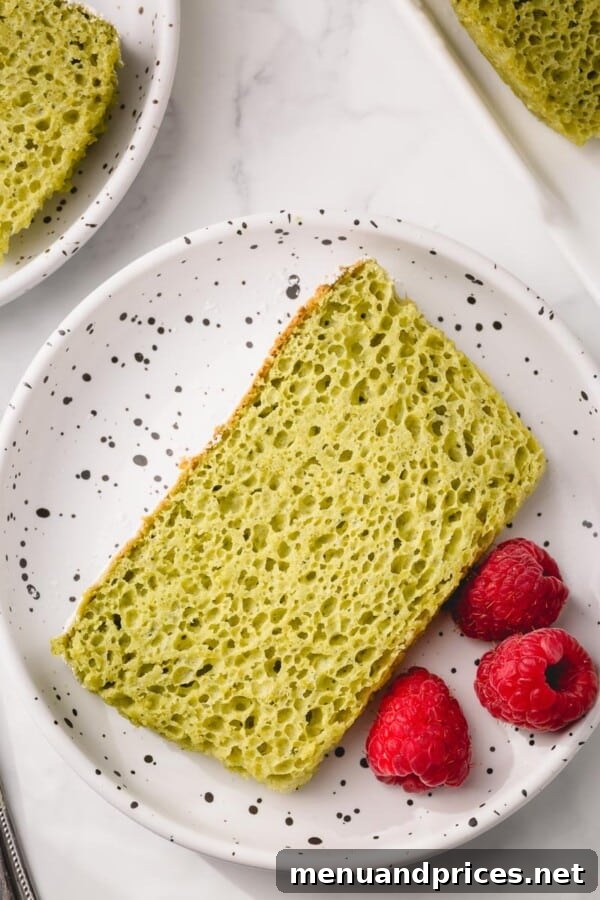 Vibrantly green matcha sponge cake slice, showing its fluffy texture with no artificial coloring.