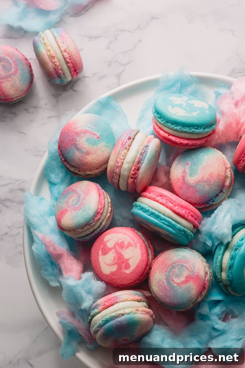 Fairground Dream Macarons 2 Beautifully marbled cotton candy macarons stacked on a white plate