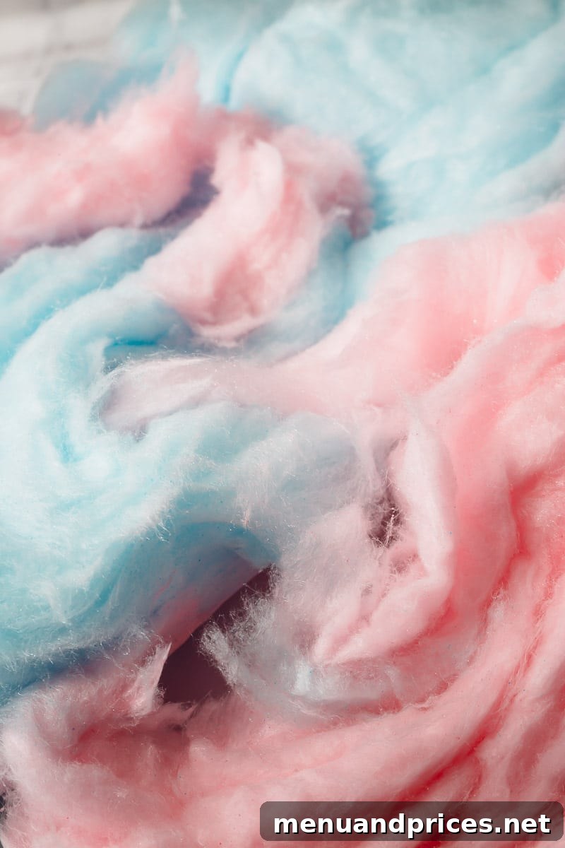 Fairground Dream Macarons 3 Close-up of a halved cotton candy macaron showing the filling