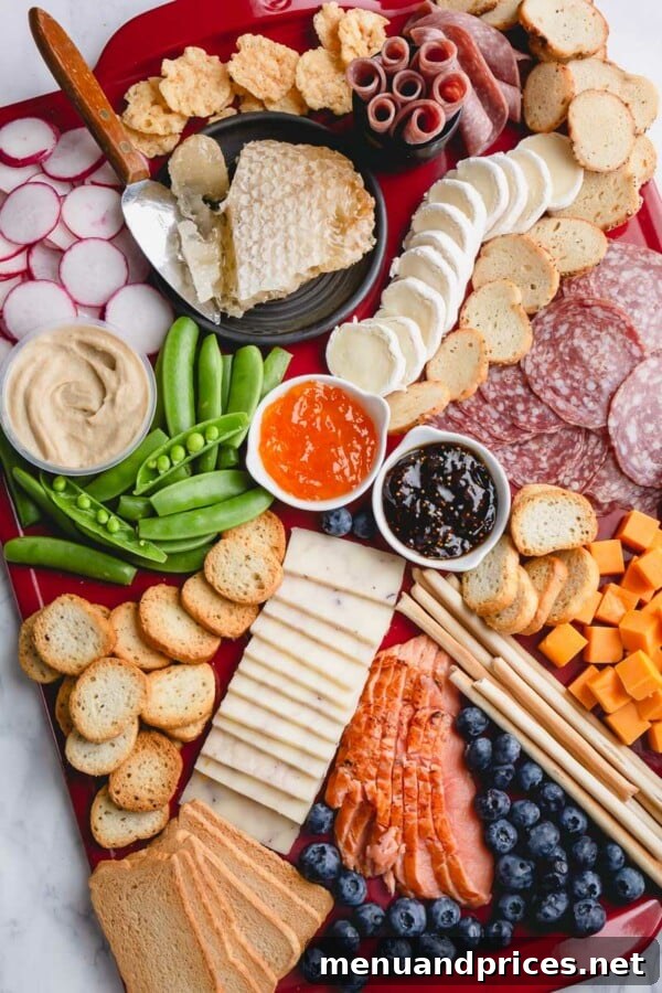 The Art of the Charcuterie Board 2 A beautifully arranged spring charcuterie board featuring cheeses, cured meats, fresh fruits, and spring vegetables.