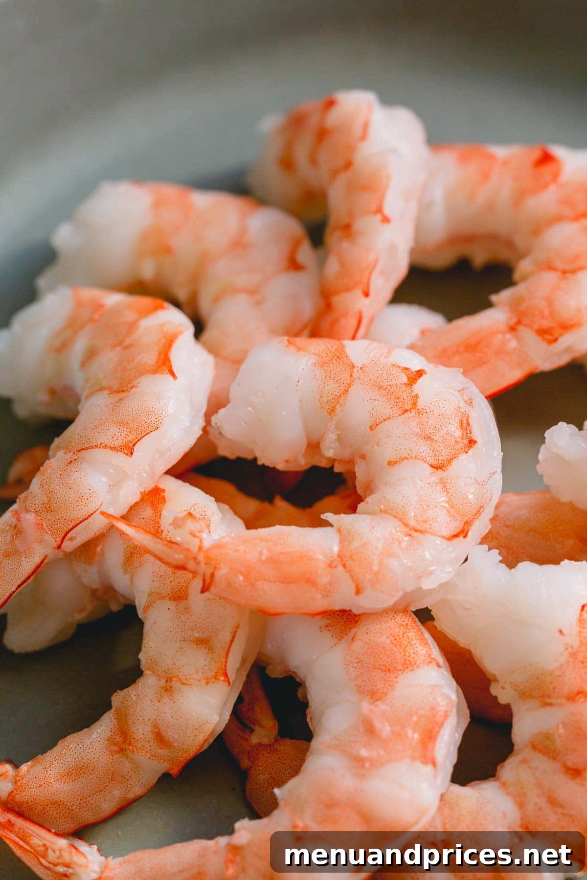 Perfectly Boiled Shrimp Every Time 2 Close up of perfectly boiled shrimp, showing their appealing pink color and curled shape.