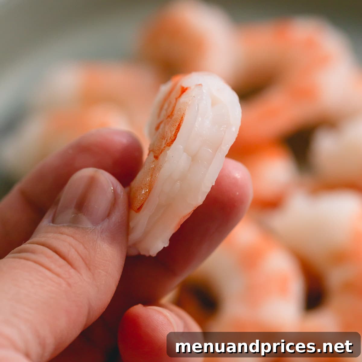 Perfectly Boiled Shrimp Every Time 6 A close-up view of fully cooked, deveined shrimp, glistening and ready to eat.