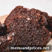 A final close-up of a sliced chocolate banana bread loaf