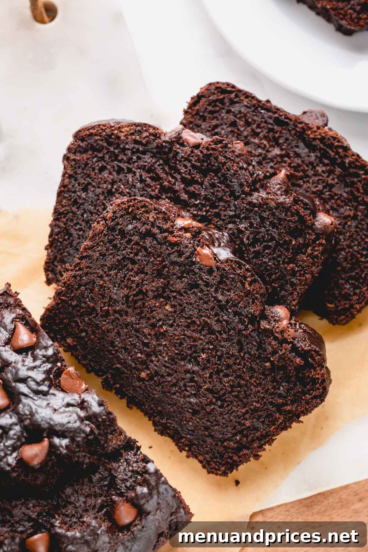 Fudgy Chocolate Banana Bread 7 An overhead shot of freshly baked and sliced chocolate banana bread, tempting and ready to be served.