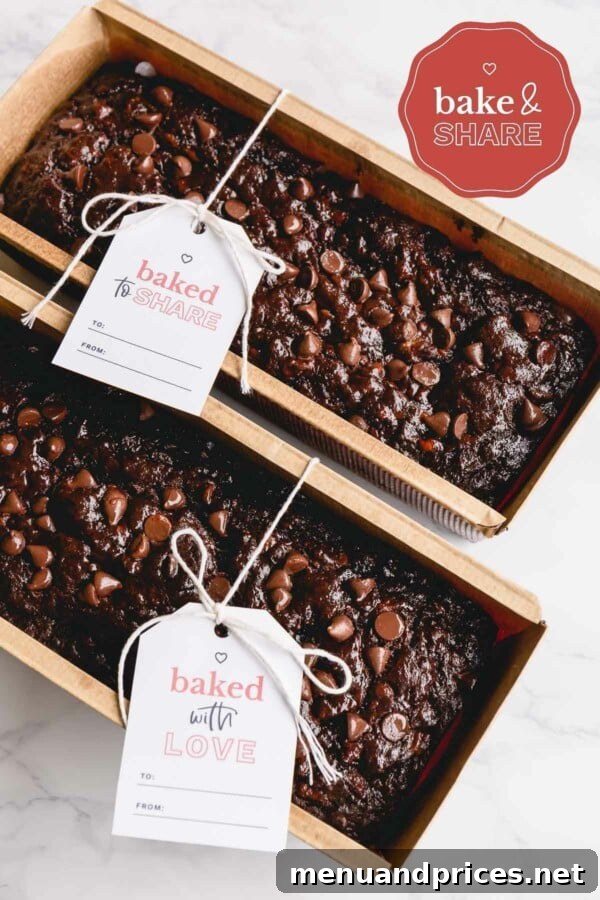 Fudgy Chocolate Banana Bread 9 Two freshly baked chocolate banana breads in disposable loaf pans, perfect for gifting.
