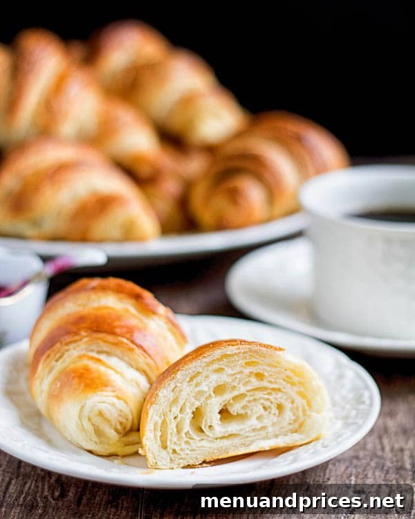 Flaky Homemade Croissants 4 A charming overhead view of multiple homemade croissants, perfectly shaped and golden, ready to be enjoyed as a delightful breakfast or snack.