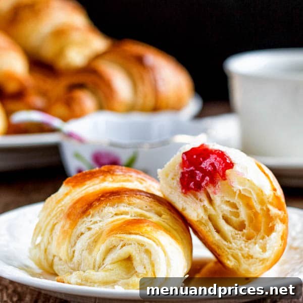 Flaky Homemade Croissants 5 A beautiful arrangement of various homemade croissants, showcasing different shapes and the delicious golden crust achieved through the baking process.