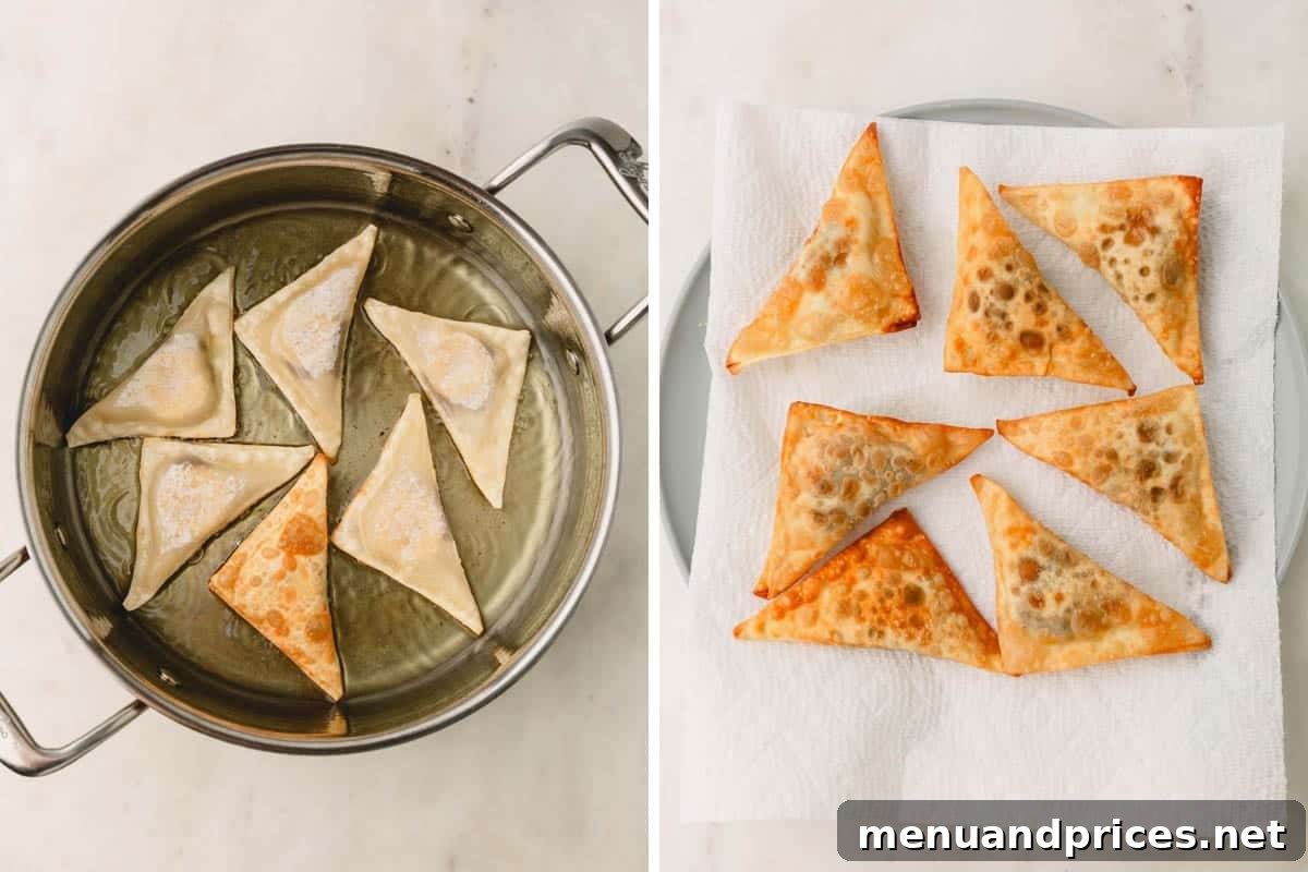 Banana Nutella wontons sizzling in hot oil in a frying pan, with finished wontons draining on paper towels beside.