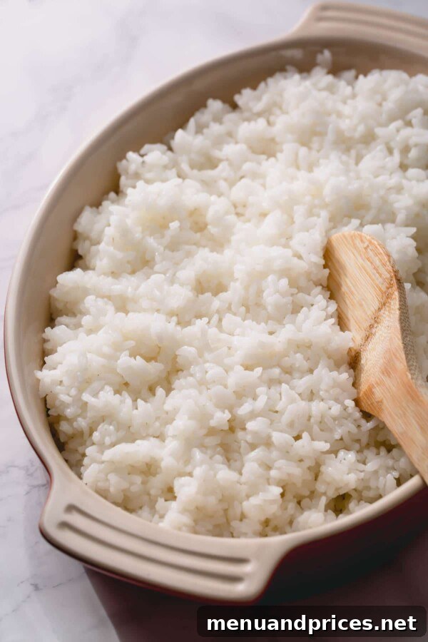 Unlock the Art of Sushi Rice 6 Close-up of perfectly fluffy and sticky seasoned sushi rice ready for use in homemade sushi rolls