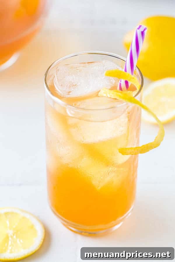 Cool Earl Grey Refresher 4 An overhead shot of several glasses of Earl Grey iced tea, garnished with lemon and ready to serve, suggesting a perfect beverage for a gathering or crowd.