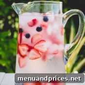 Infused water varieties in stylish pitchers and glasses.