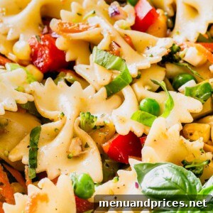 Delicious Veggie Pasta Salad garnished with fresh basil, showcasing its vibrant colors and appealing texture.