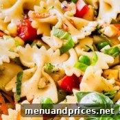 Close-up of the delicious rainbow pasta salad with fresh ingredients and vibrant colors.