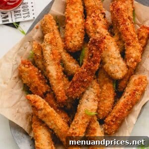 A basket of golden-brown fried pork strips.