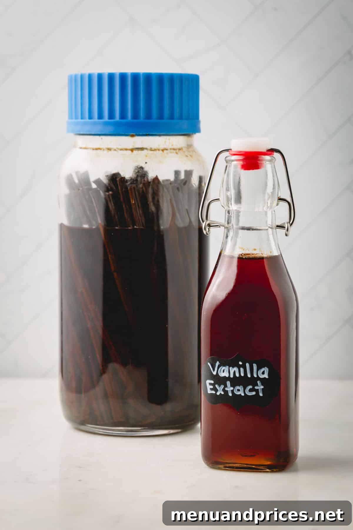 The Art of Homemade Vanilla Extract 3 Big jar of homemade vanilla extract with vanilla beans and a smaller bottle of vanilla extract, highlighting the versatility of sizes.