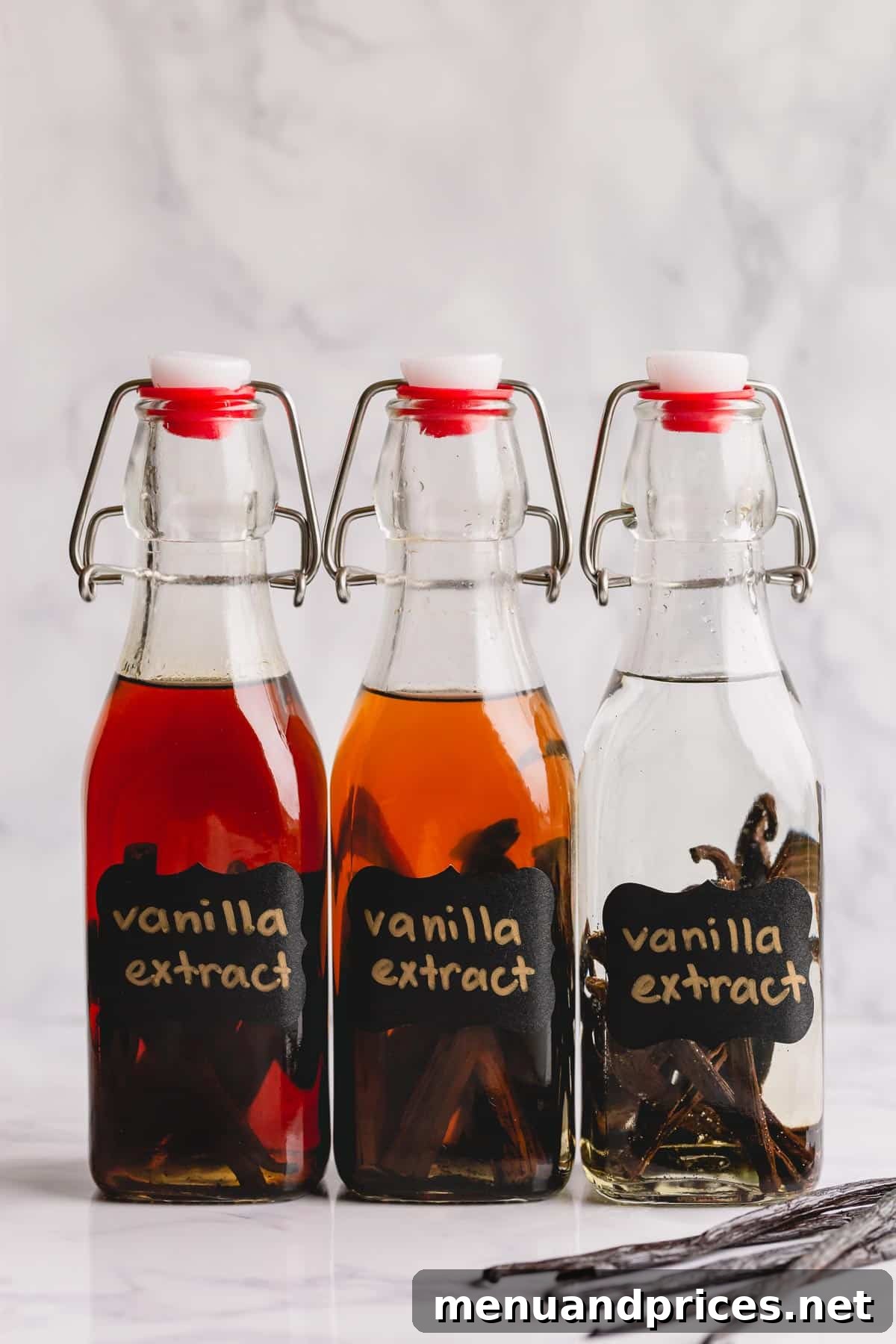 The Art of Homemade Vanilla Extract 9 Three bottles of Homemade vanilla bean extracts, showcasing various stages of infusion or different batches.