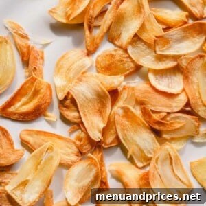 A bowl of crispy fried garlic chips, perfectly golden and ready to top any dish.