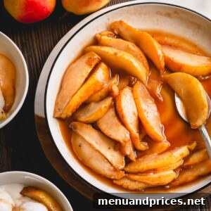 Caramelized pear slices with sauce in a white plate.