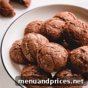 A final close-up of a stack of macaron brownie cookies, emphasizing their rich texture and delicious appeal.