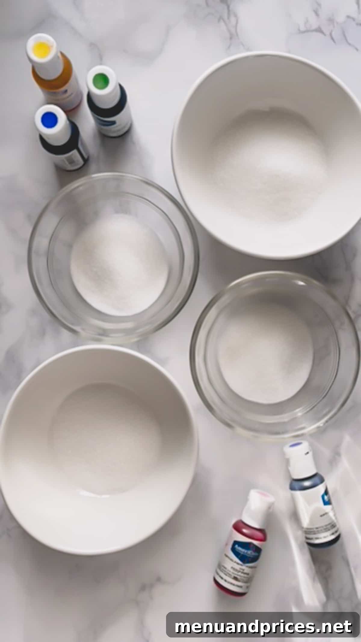 Whip Up Vibrant Homemade Sugars 3 Bowls containing plain granulated sugar and various gel food colorings, ready for mixing.