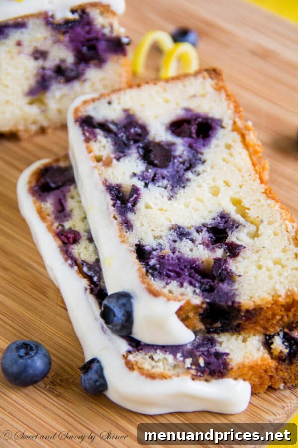 Zesty Blueberry Lemon Delight 3 Close-up of a tender blueberry lemon cake slice, showing a delicate crumb and vibrant blueberries.