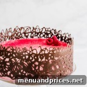 Sculpting Edible Chocolate Cages 4 Finished chocolate cage decoration on a cake, ready for serving.