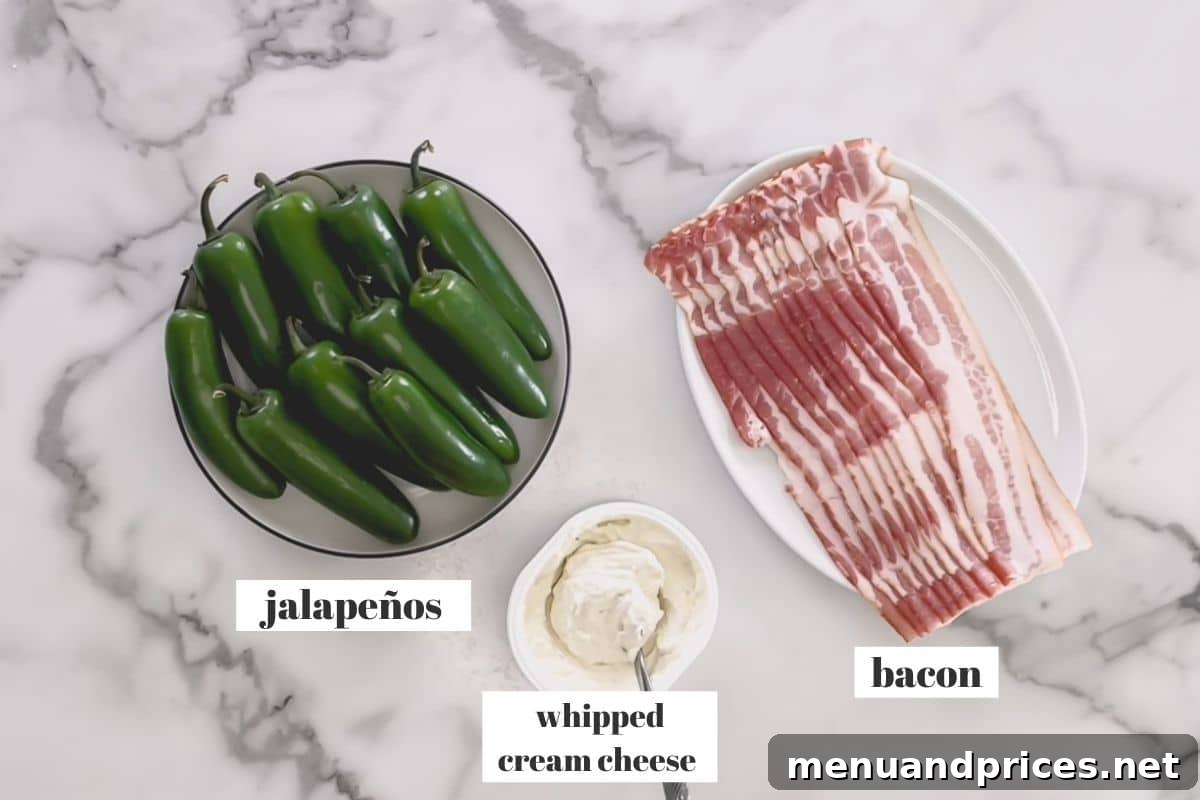 The three essential ingredients for easy jalapeno poppers: fresh green jalapenos, soft whipped cream cheese, and strips of thin-cut bacon.