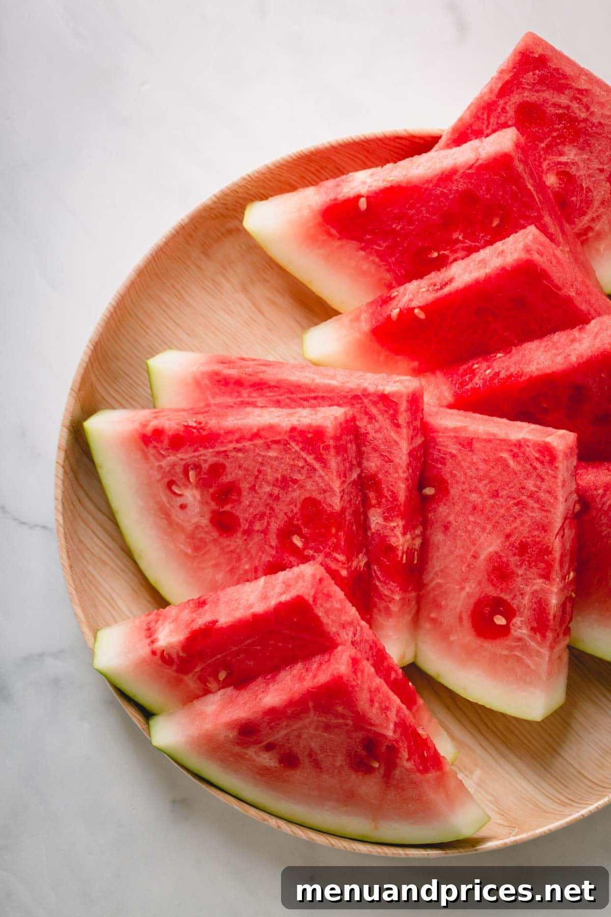 Unlock the Perfect Watermelon Slice 6 A vibrant platter filled with freshly cut watermelon wedges, ready to be served and enjoyed.