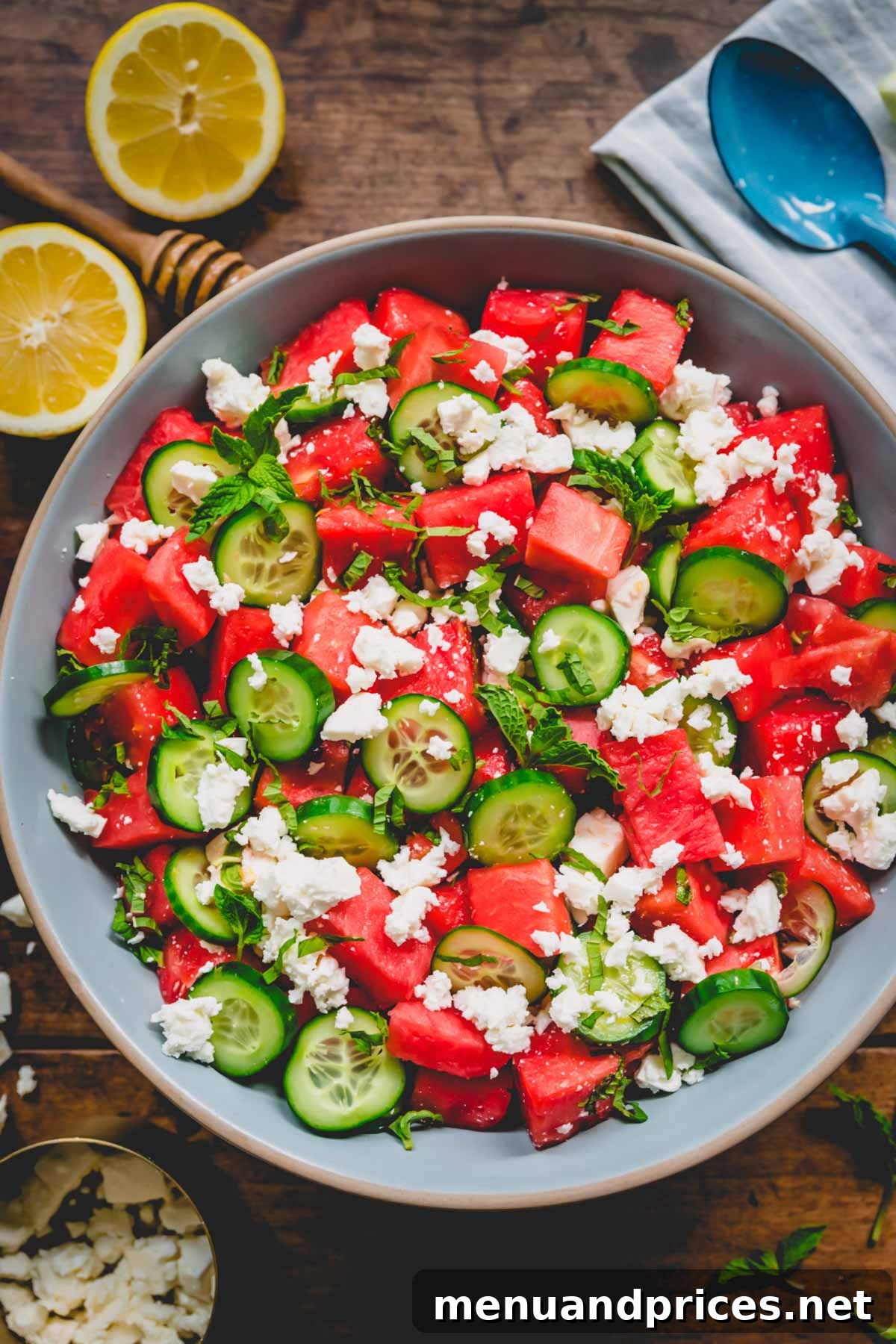 Summer Watermelon Feta Medley 2 A large serving plate filled with vibrant Watermelon Feta Salad, garnished with fresh mint.