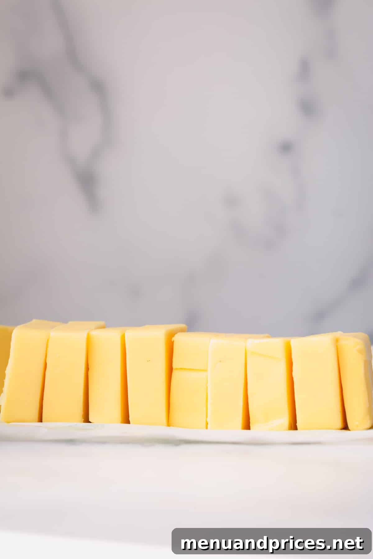 Butter Fundamentals 5 Another perspective of sliced butter blocks, emphasizing their readiness for culinary use.