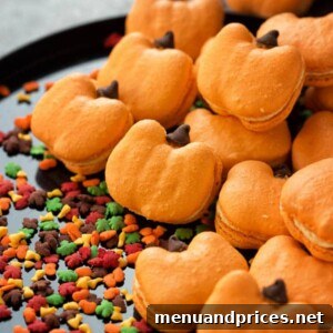 Pumpkin Spice Macarons 6 Close-up of a stack of pumpkin macarons, showcasing their vibrant orange color and delicate texture.
