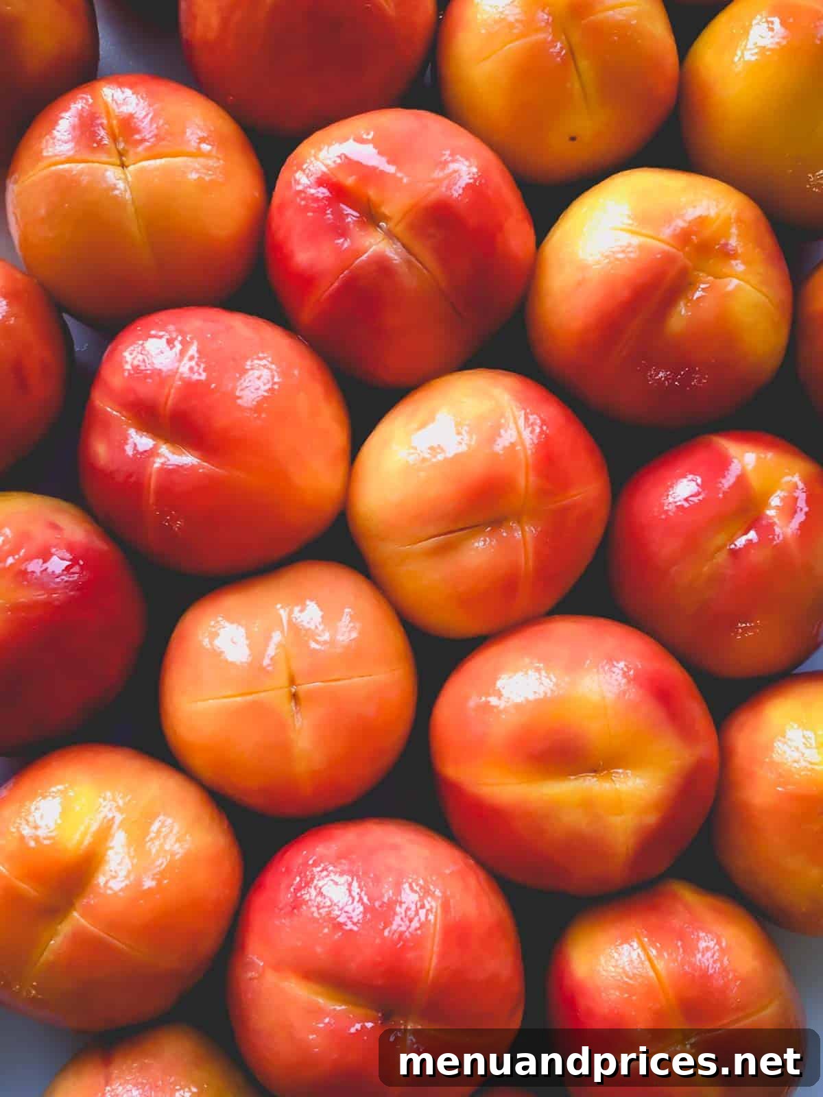 Peach Peeling Made Easy 3 Lots of perfectly peeled peaches, stacked in a bowl.