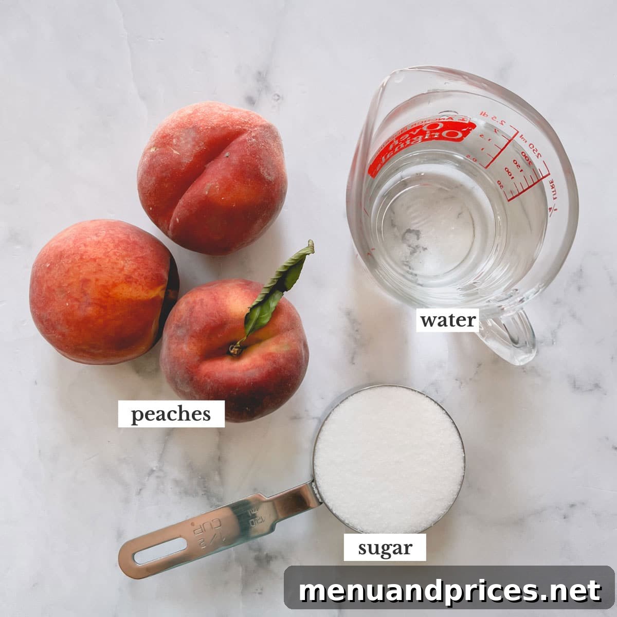 Three ripe peaches, a measuring cup filled with granulated sugar, and a glass of water, highlighting the simple ingredients for the syrup.