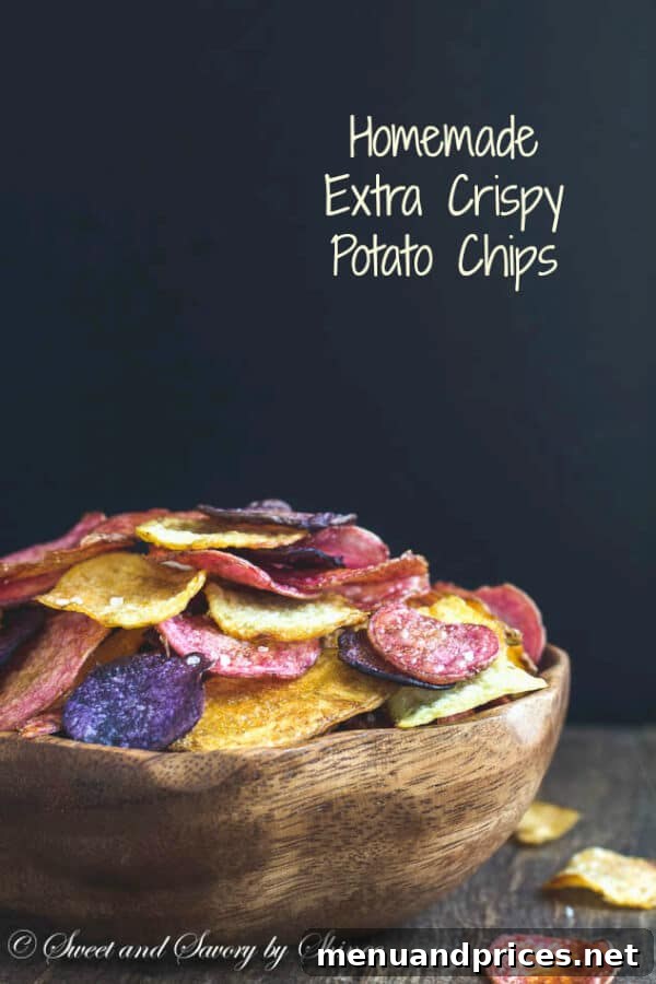 Ultra-Crisp Oven Potato Chips 4 A close-up shot of freshly fried potato chips, showcasing their golden crispness and inviting texture.