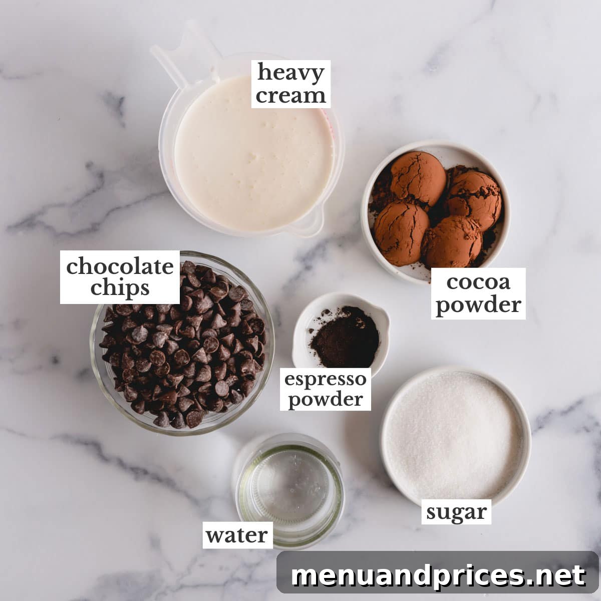 Silky Chocolate Mousse Delight 3 A flat lay of the essential ingredients for chocolate mousse filling, including chocolate chips, cocoa powder, heavy cream, and sugar.