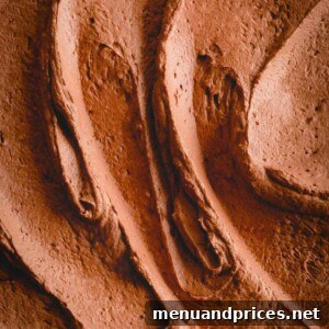 Rich chocolate mousse frosting upclose.