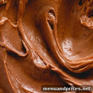 Upclose photo of smooth chocolate buttercream piped into a swirl.