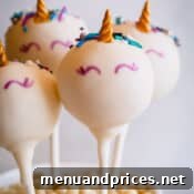 Unicorn cake pops elegantly displayed in a cup, ready to be enjoyed.