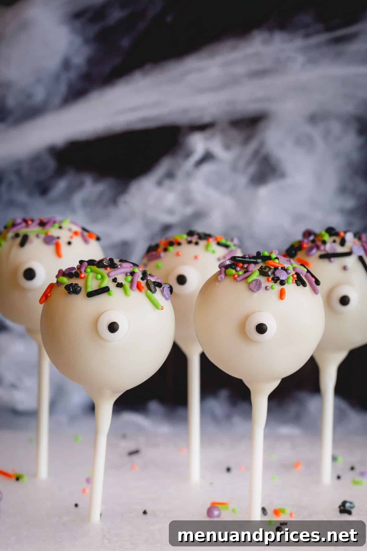 Foolproof Cake Pop Delight 10 Spooky and fun Halloween-themed cake pops with playful sprinkles and candy eyes.